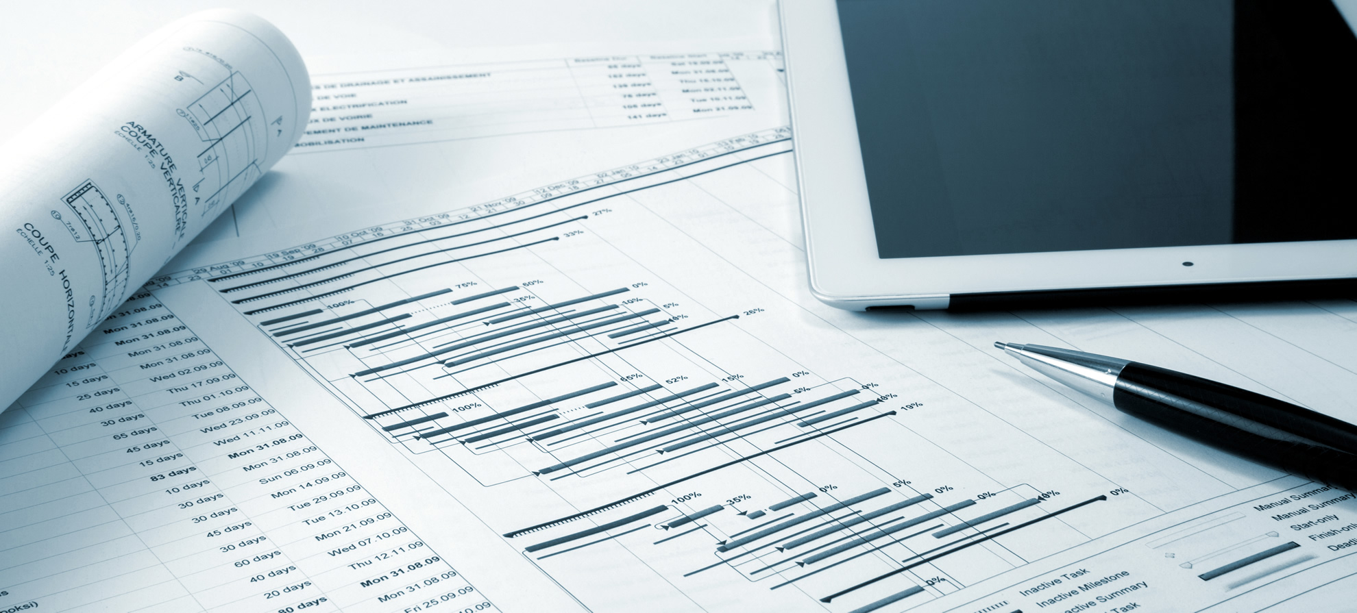 Technical drawings and project plans on an engineering desk